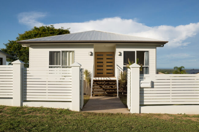 New modern contemporary house exterior with fence and front door